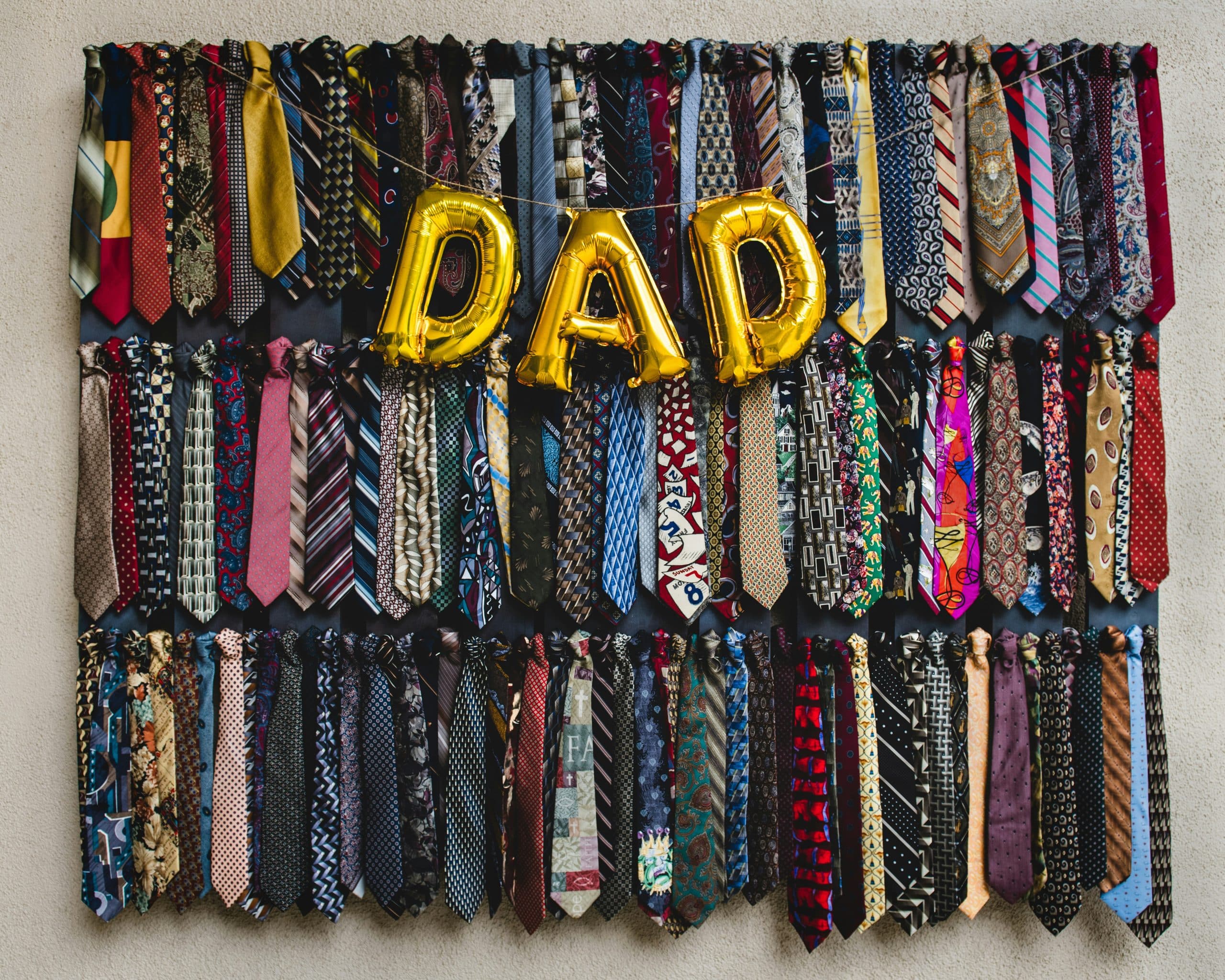 Dad balloons with an assortment of mens ties